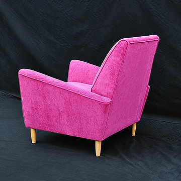 Upholstered armchair rear three quarter view