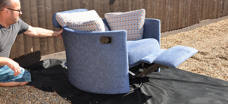 The upholsterer and the chair reupholstered