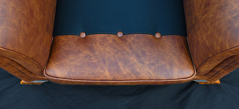 Hand-made leather seat platform retaining buttons