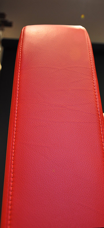 Club chair upholstery with colour-matched top stitch arm detail