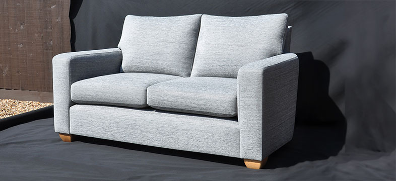 Sofa reupholstered in grey fabric